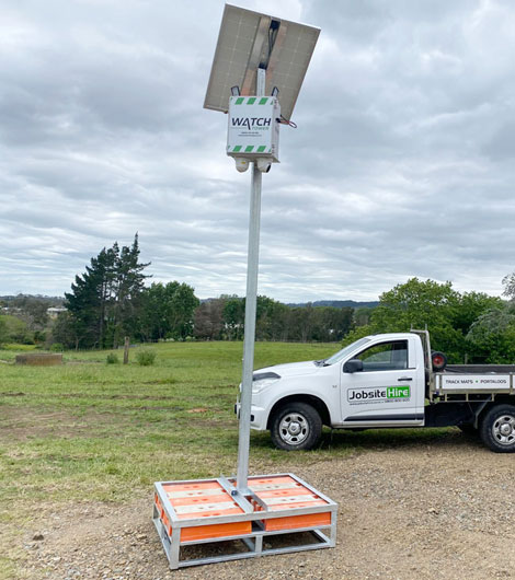 Security camera tower set up in an open paddock