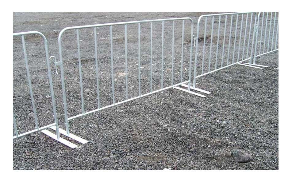 Crowd control barrier panels set up on gravel